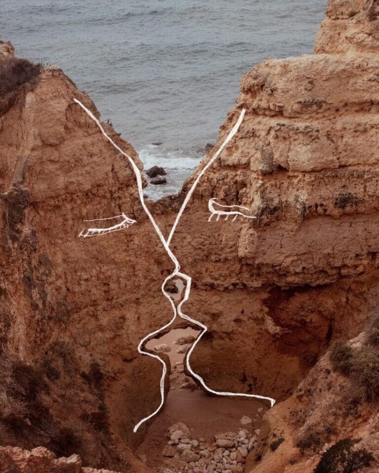 An Interview with Koketit: Minimalistic Gesture Meets Romantic Soul Delicate face profile created with white chalk on rocky coastal cliff, beach and ocean background.