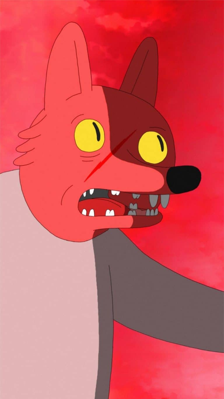 "COYOTE" Explores A Depth Of Human Emotions Distorted cartoon cat with yellow eyes, split face, snarling expression against a red sky background.