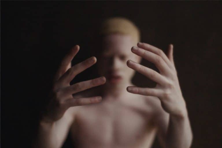 "My Kingdom Come" Highlights The Question Of Responsibility Elegant woman with expressive hands, artistic portrait, minimalistic photography, soft lighting, artful composition.
