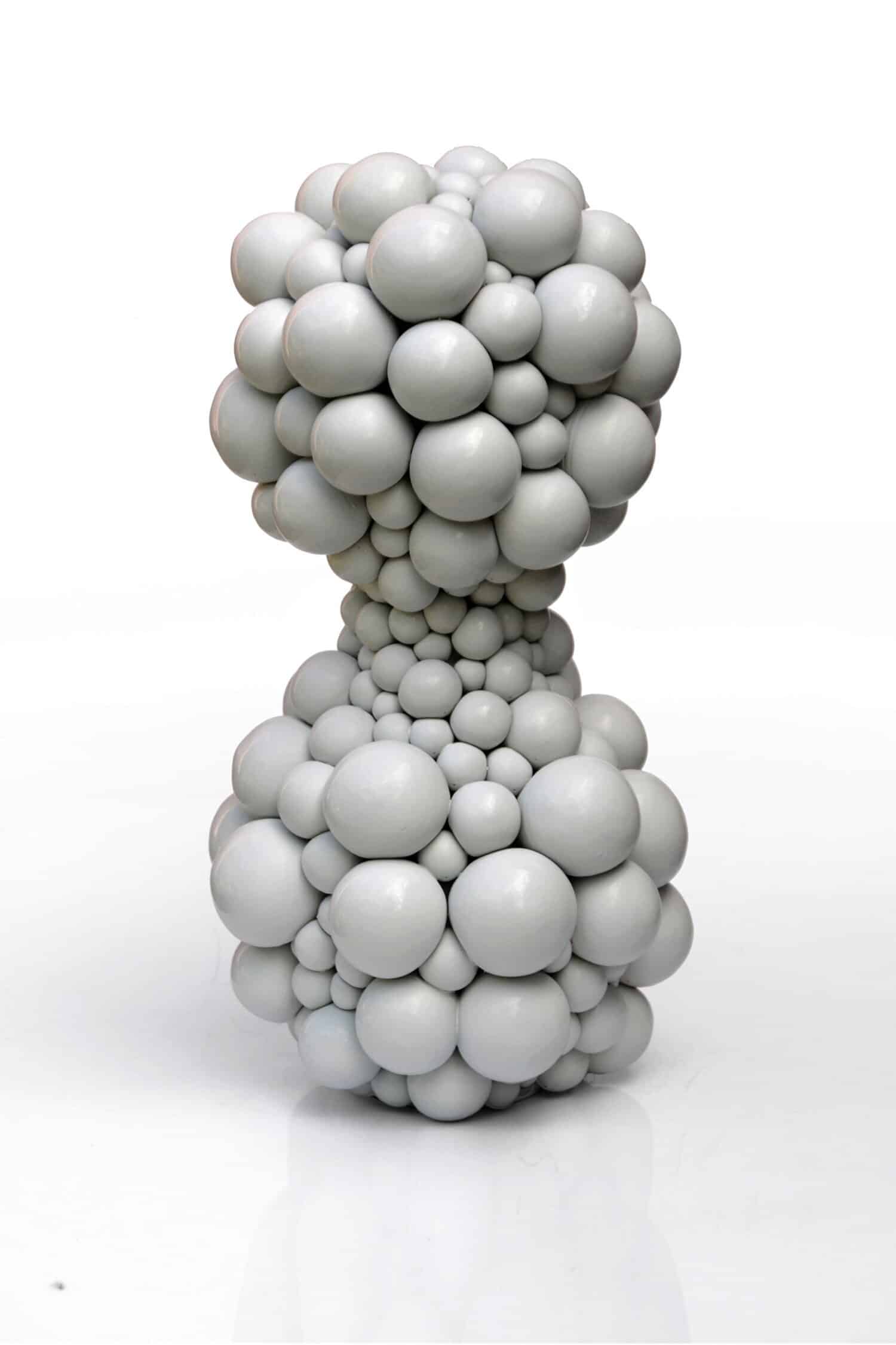 Sculpture made of white spheres in abstract form for modern art collection.