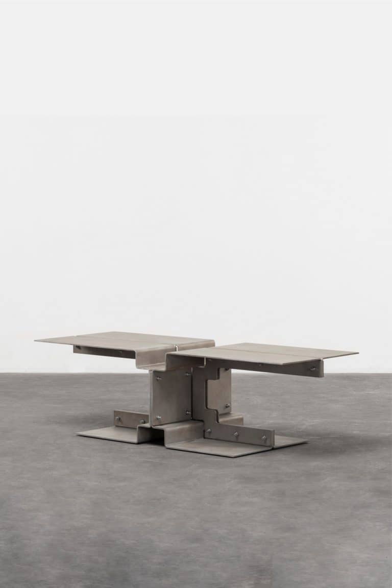Wendy Andreu And Bram Vanderbeke Envision The Multitude Of Furniture Pieces Modern stainless steel geometric coffee table with modular design, minimalistic style, and industrial appeal.