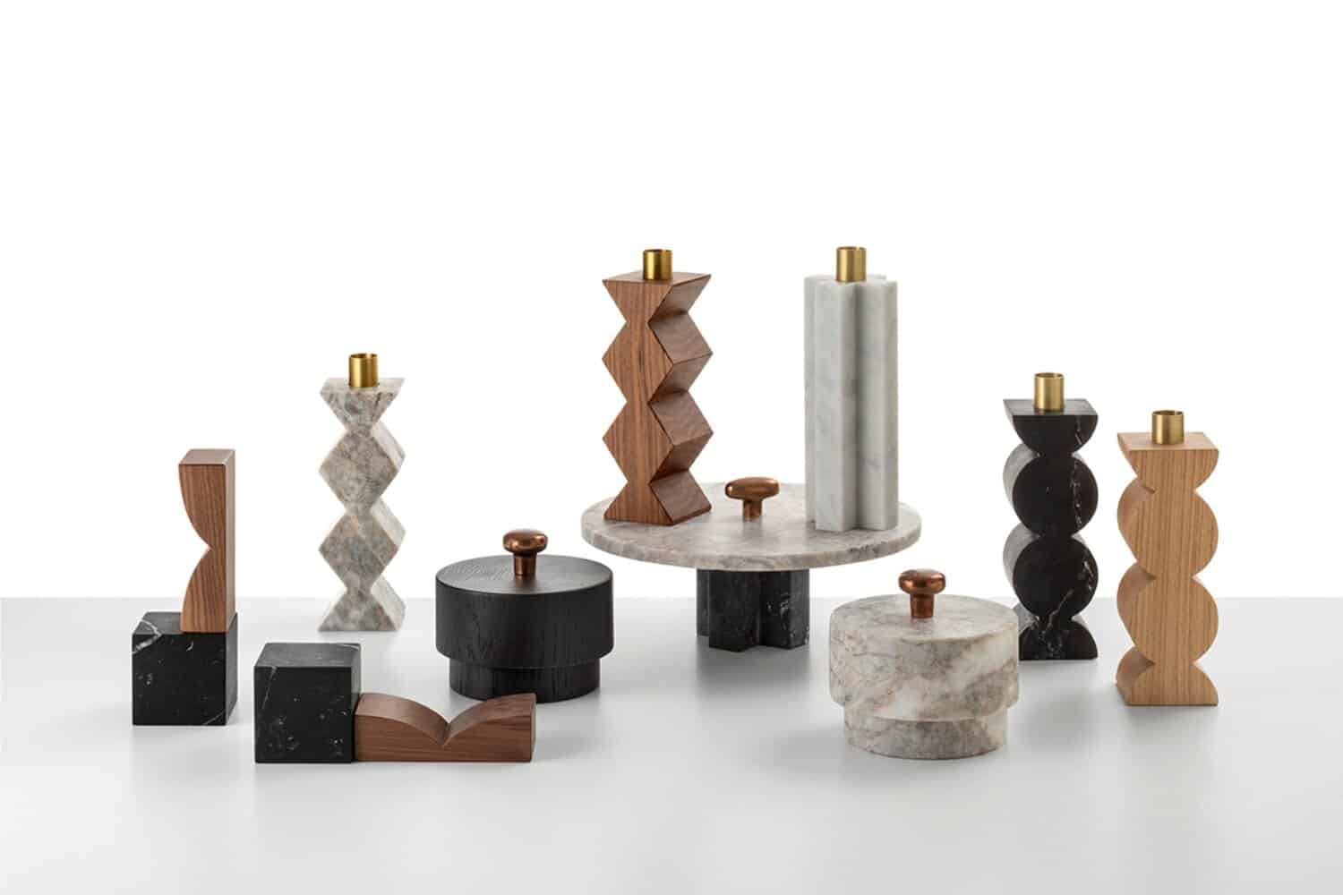 Decorative modern marble and wood candlesticks with geometric designs for home decor.