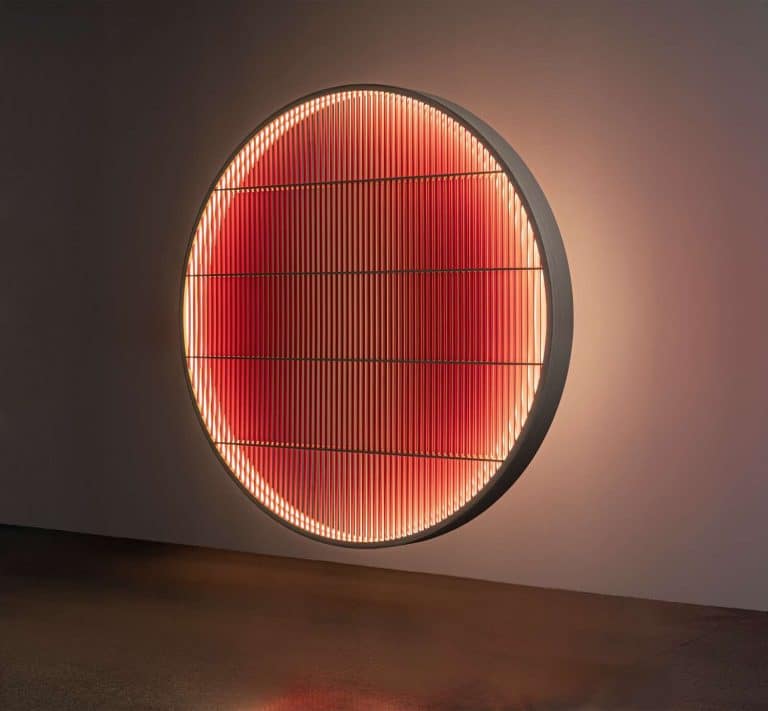 Ane Lykke Generates An Everchanging Experience By Kurenai Light Object Illuminated circular wall art with red LED lights and modern geometric design.