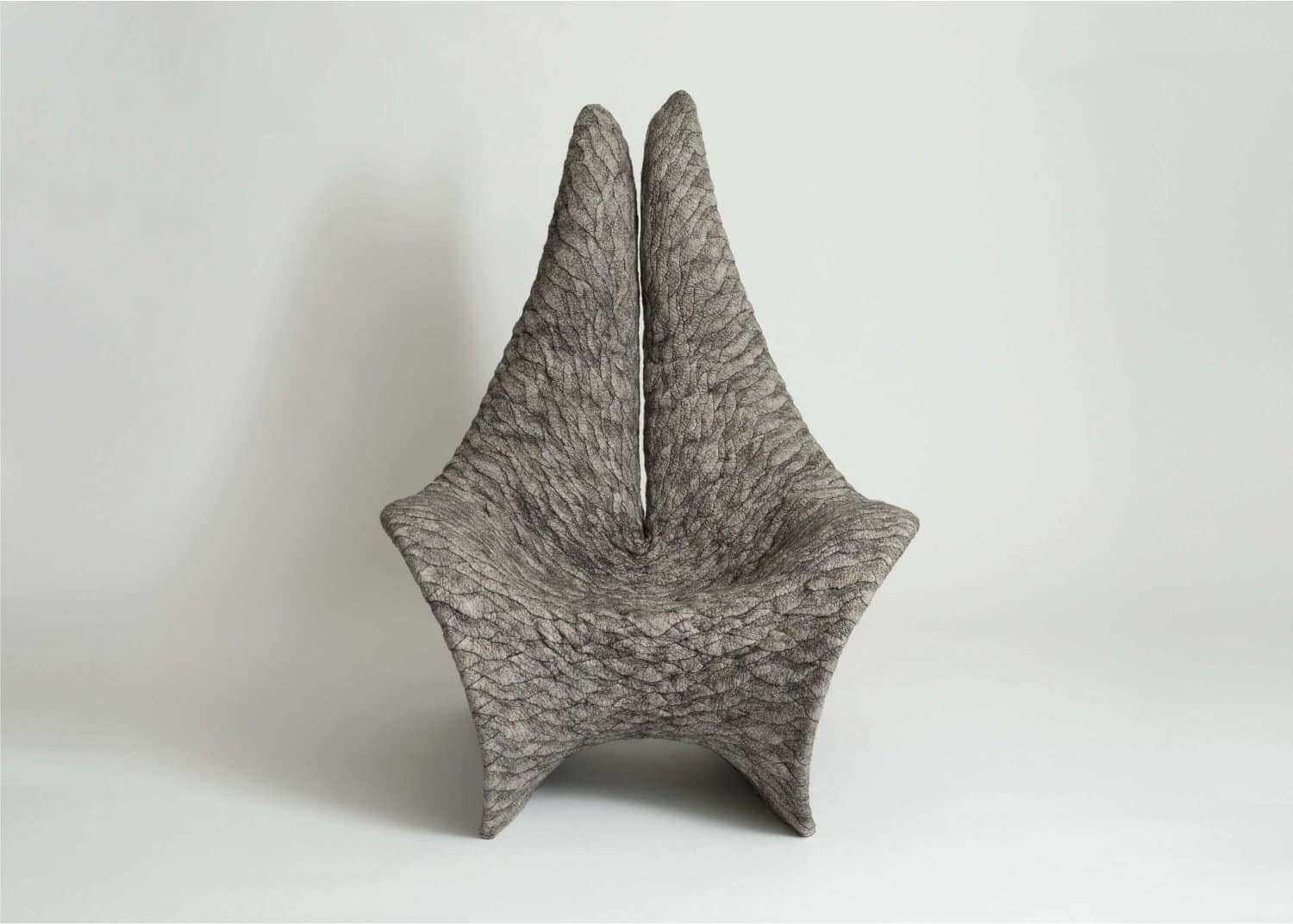 Unique textured ceramic star-shaped sculpture for modern home decor.