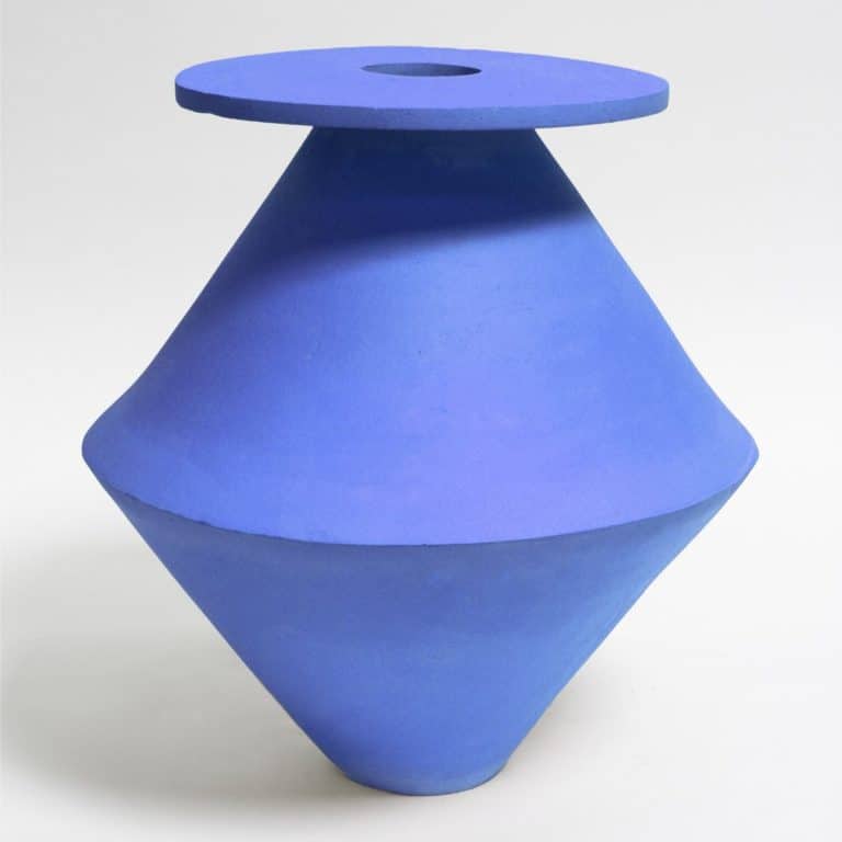 BZIPPY Investigates Consumerism Through The Sustainable Art Bold blue geometric ceramic vase with a modern, minimalist design ideal for contemporary home decor.