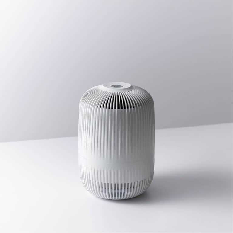 Air purifier with modern design and sleek white finish, ideal for home or office use.