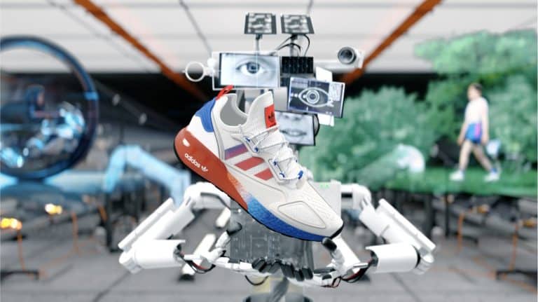 Hypebeast And Builders Club Collaborate On A Surreal Campaign For Adidas Originals China High-tech Adidas sneaker displayed by robotic arm in a futuristic lab setting.