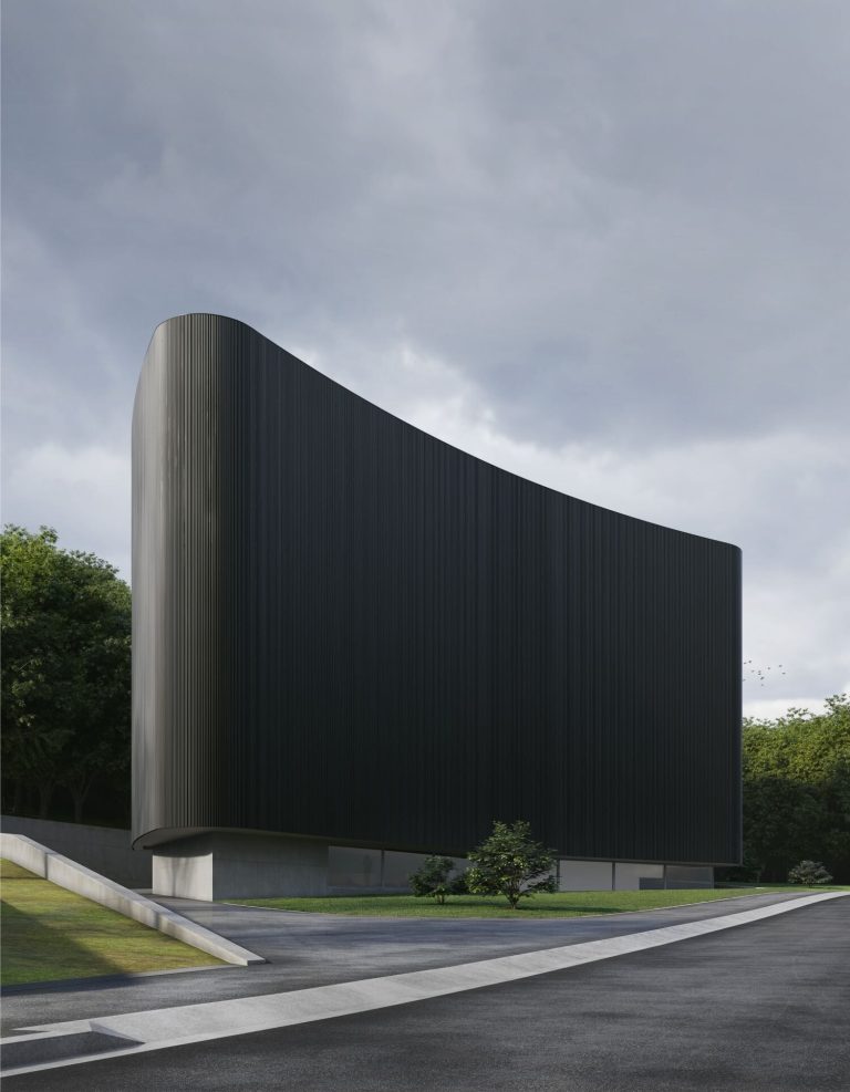 Alvaro Siza + Carlos Castanheira Designs Immense Interior Of MoAE Futuristic black modern building with sleek design and curved architecture.