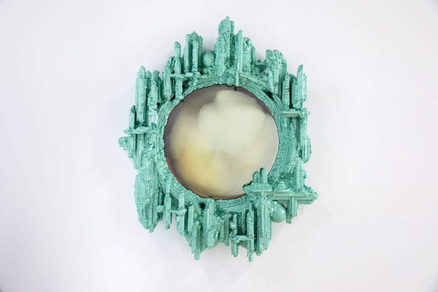 Intricate turquoise mirror with a futuristic cityscape design, modern art piece at Visual Atelier 8.
