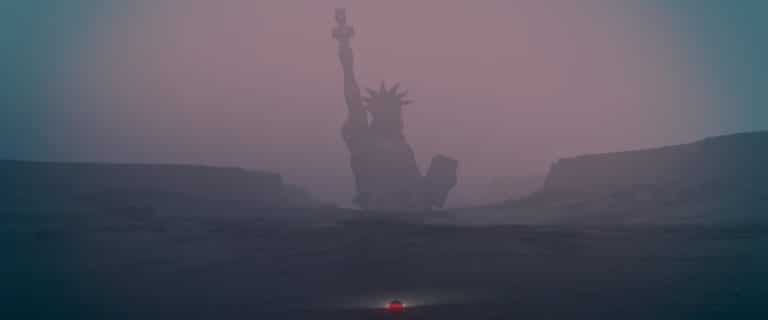 Cornel Swoboda Brings The Story Of Political Worship Cult A foggy scene of the Statue of Liberty with a mysterious and moody atmosphere.