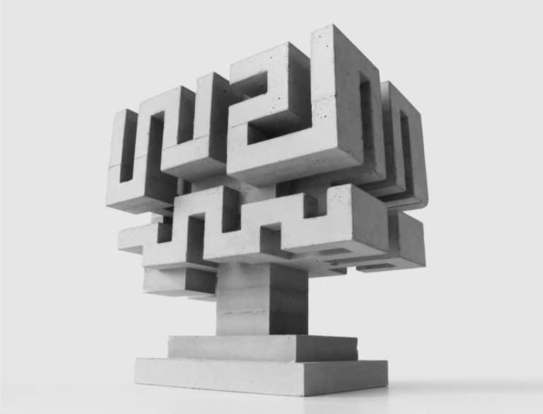 David Umemoto Studies Volume In A Concrete Works Collection Concrete geometric sculpture with intricate block design, modern art installation, monochrome, creative architecture, minimalistic style.