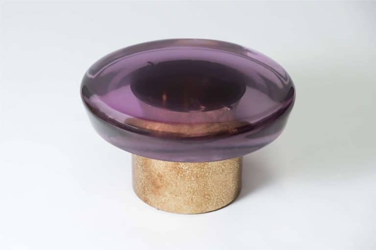 Draga & Aurel Designs Jade Coffee Tables In "Transparency Matters" Collection Vibrant purple glass bowl with beige textured base, modern decorative art piece.