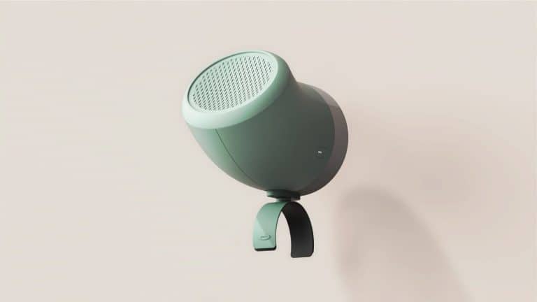 Wireless portable speaker with sleek modern design in mint green and black, perfect for stylish home audio.