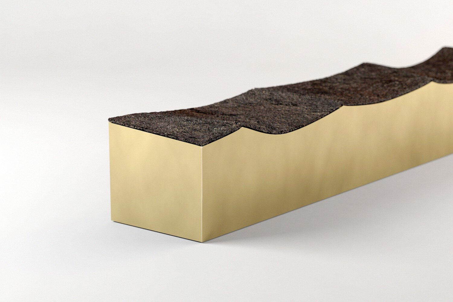 Dark asphalt shingle cross-section on gold display block, close-up view.