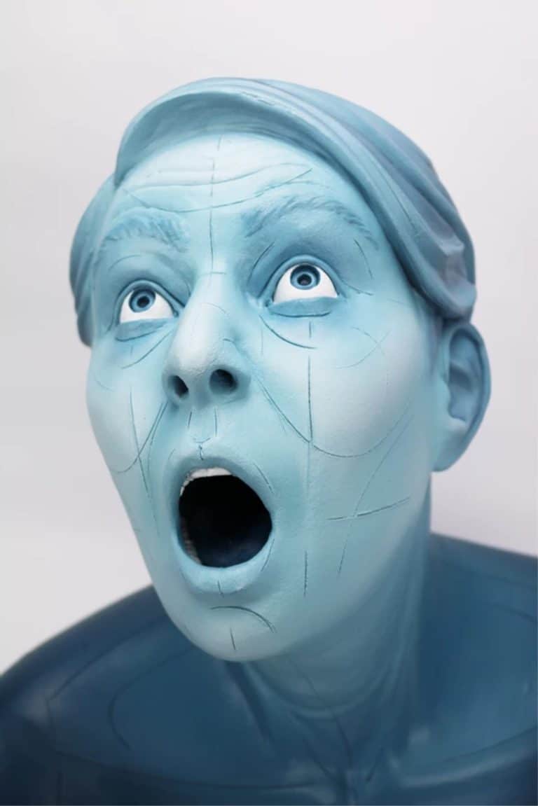 The Expressive Bodily Ceramics Crafted At The Hands Of Jamie Bates Slone Blue humanoid sculpture with surprised expression, modern digital art piece, unique artistic installation at Visual Atelier 8.