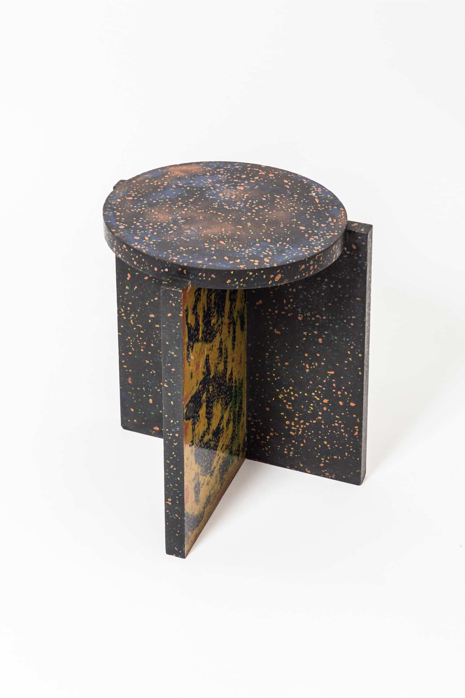 Colorful speckled modern side table with artistic design, perfect for contemporary interior decor.