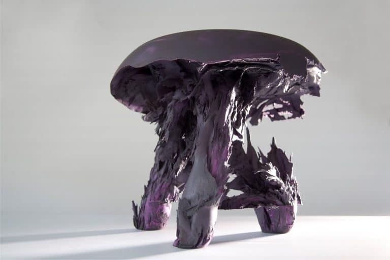 Gravity Stool By Jólan Van Der Wiel Makes A Dialogue With A Natural Phenomenon Vibrant purple and black contemporary sculpture resembling an abstract mushroom or organic form.