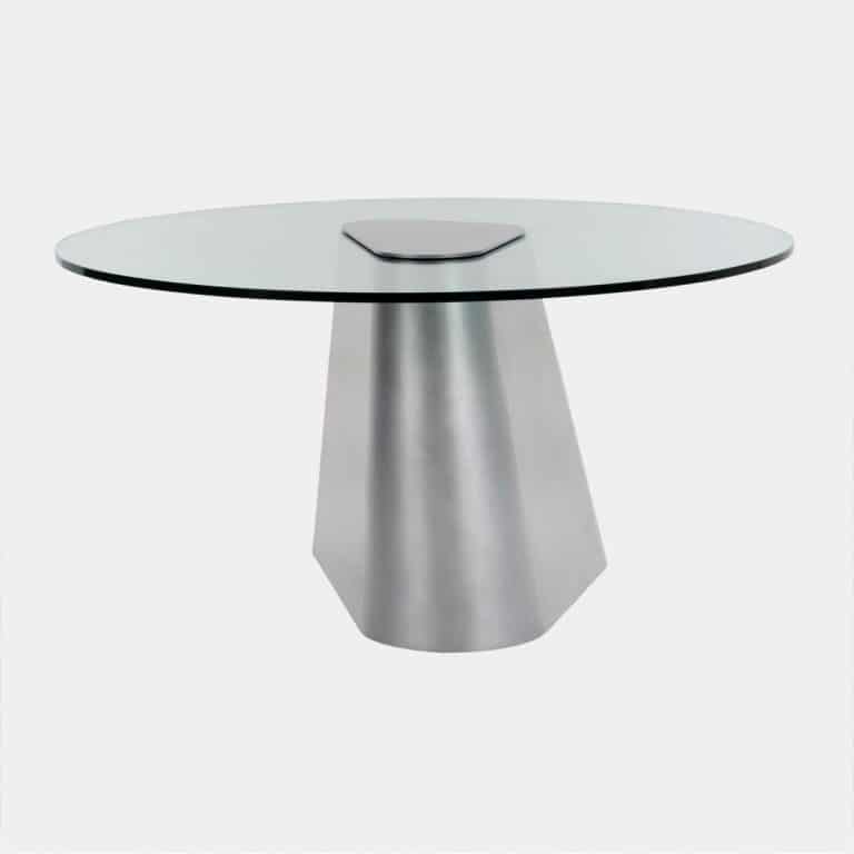 Jonathan Nesci Uses Digital Fabrication Processes Sleek modern glass dining table with metallic base for contemporary interior design.