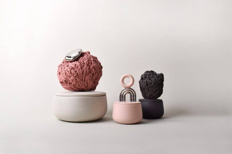 Sculptural Series As Timeline Of Endless Experiments By Laura Itkonen Colorful modern ceramic vases with textured designs on minimalist white background.
