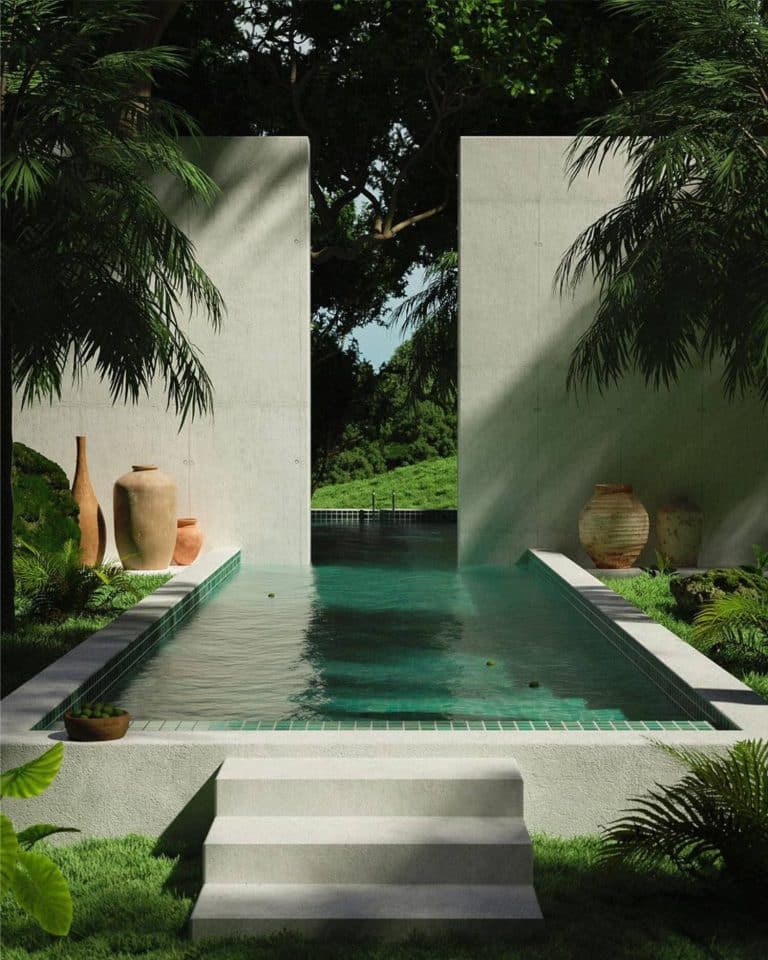 The Experimentally Progressive Designs Of Maison De Sable Modern outdoor pool with minimalist concrete walls and lush tropical greenery, perfect for relaxation.