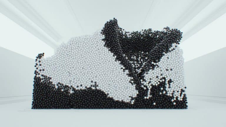 Maxim Zhestkov Is Breaking Boundaries Of Visual Language Black and white art sculpture made of spheres in modern gallery setting.