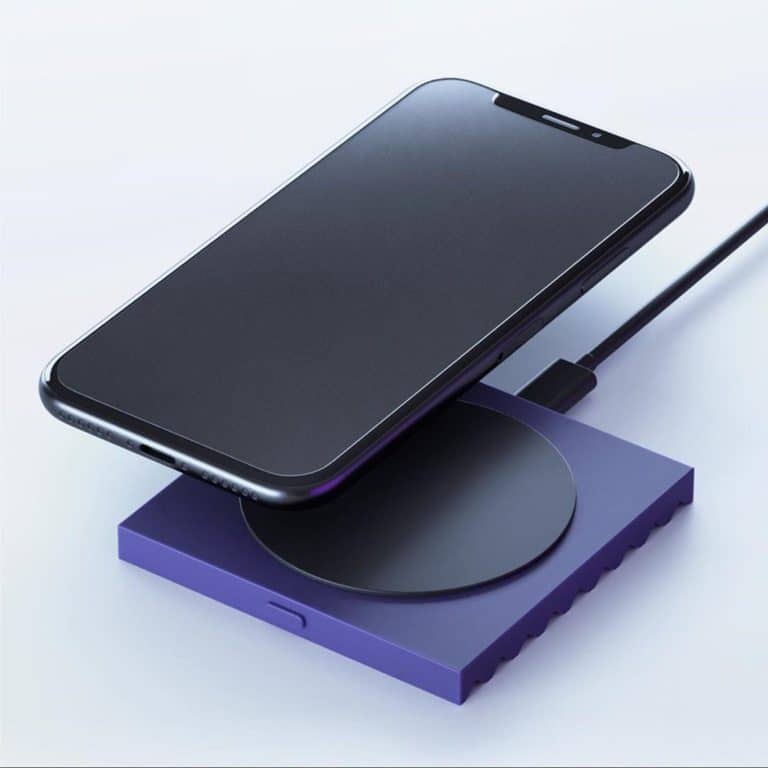 Wireless charging smartphone on modern charging pad, technology and innovation concept.