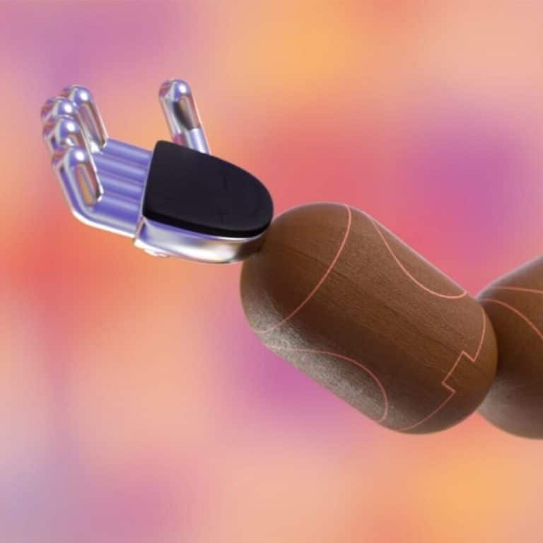 Patrick Dias Brings The Story Of Missed Connections Futuristic robotic hand with wooden finger model, highlighting innovative design and advanced technology.