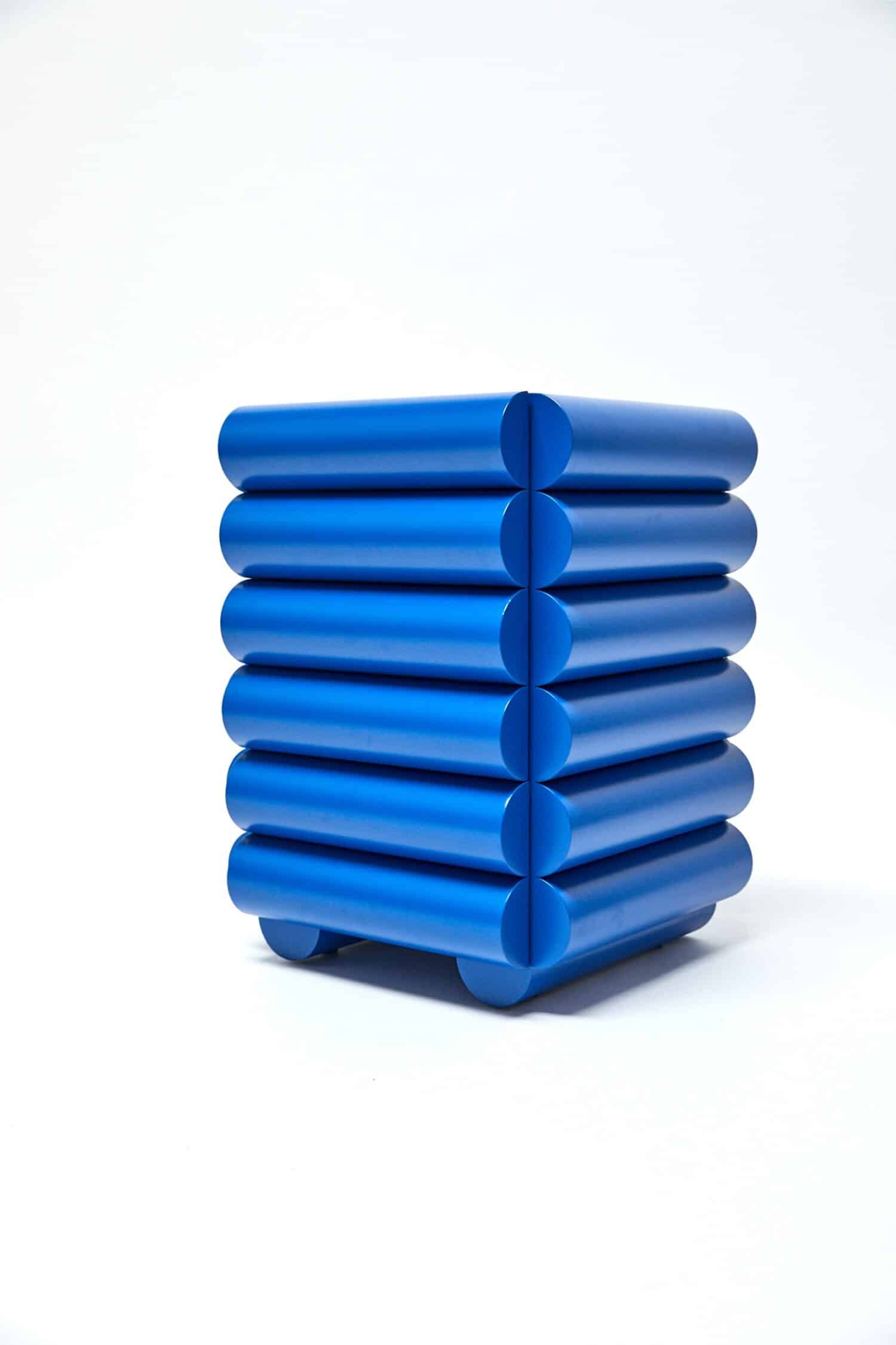 Vibrant blue stacking storage unit with rounded edges, modern minimalist design perfect for contemporary interiors.