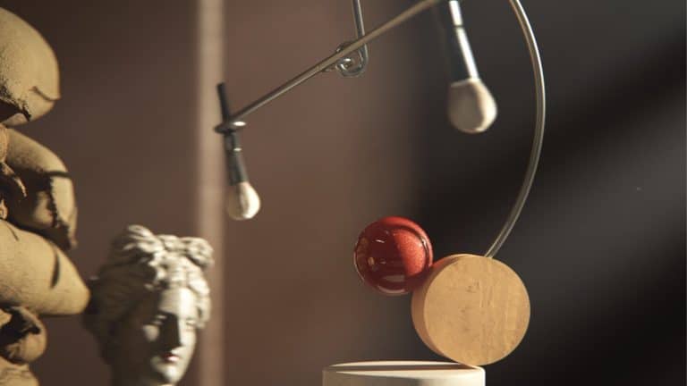 "Brushes" Emphasize The Relation Of Environment And Movement Modern kinetic sculpture art piece featuring a rotating red sphere and circular elements.