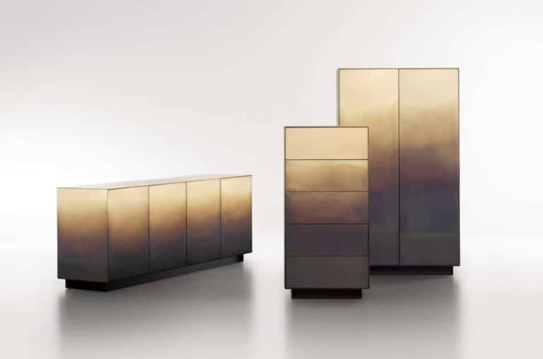 Zanellato/Bortotto Studio Creates Painterly Effect Of Marea Collection Reflective modern storage cabinets with a gradient metallic finish in gold and bronze tones.