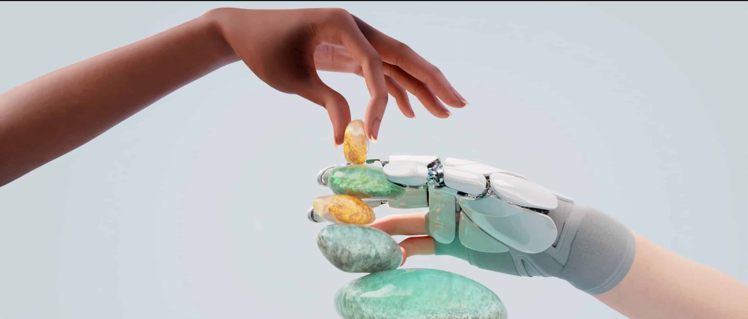 Colorful glass art installation with human hand and robotic hand reaching for each other.