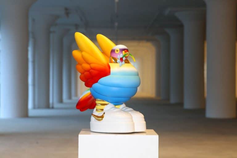 There is true beauty around you: Interview with New York-based art studio, Another Day Vibrant colorful balloon sculpture of a bird with wings, displayed in a modern art gallery setting.