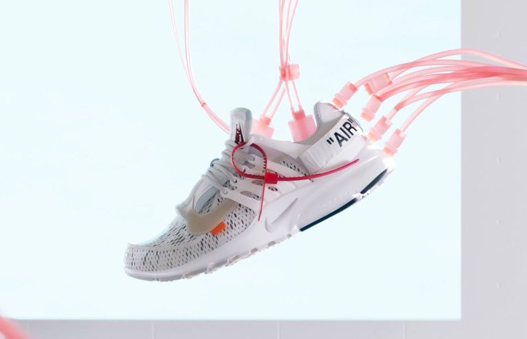 Guillaume Combeaud: A Master of Motion Design and Creative Innovation Futuristic white sneaker with pink tubes and laces, modern design, inspired by high-tech fashion and innovation.