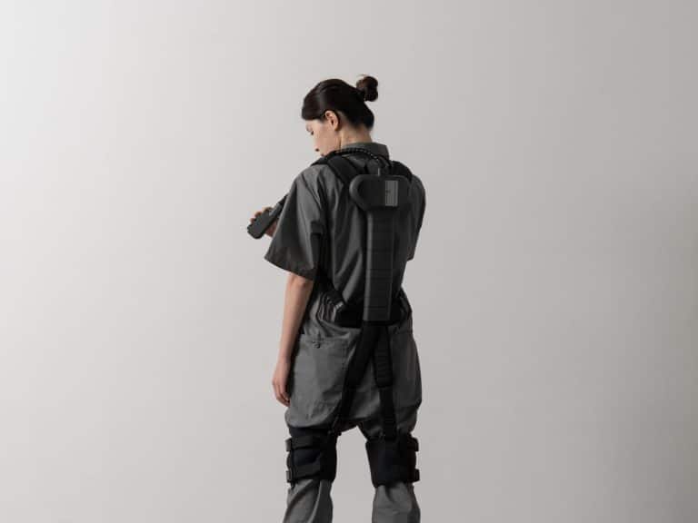 WIBS: An Innovative Wearable Back Support System Researcher with 3D scanning backpack, modern technology, innovative design, digital imaging equipment, minimalistic background.