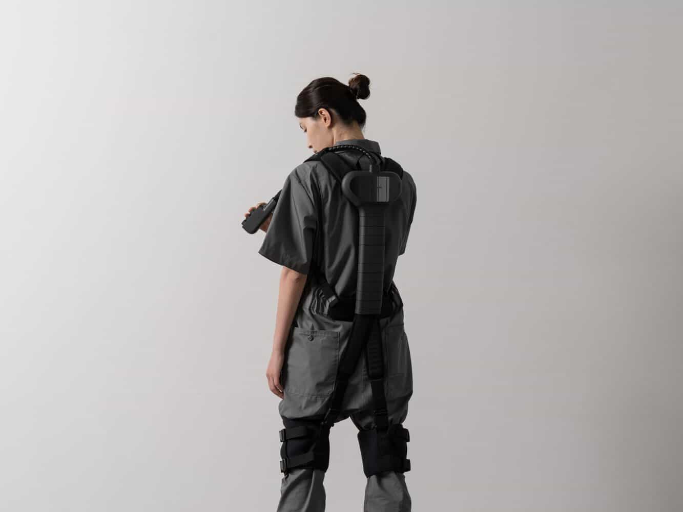 Researcher with 3D scanning backpack, modern technology, innovative design, digital imaging equipment, minimalistic background.