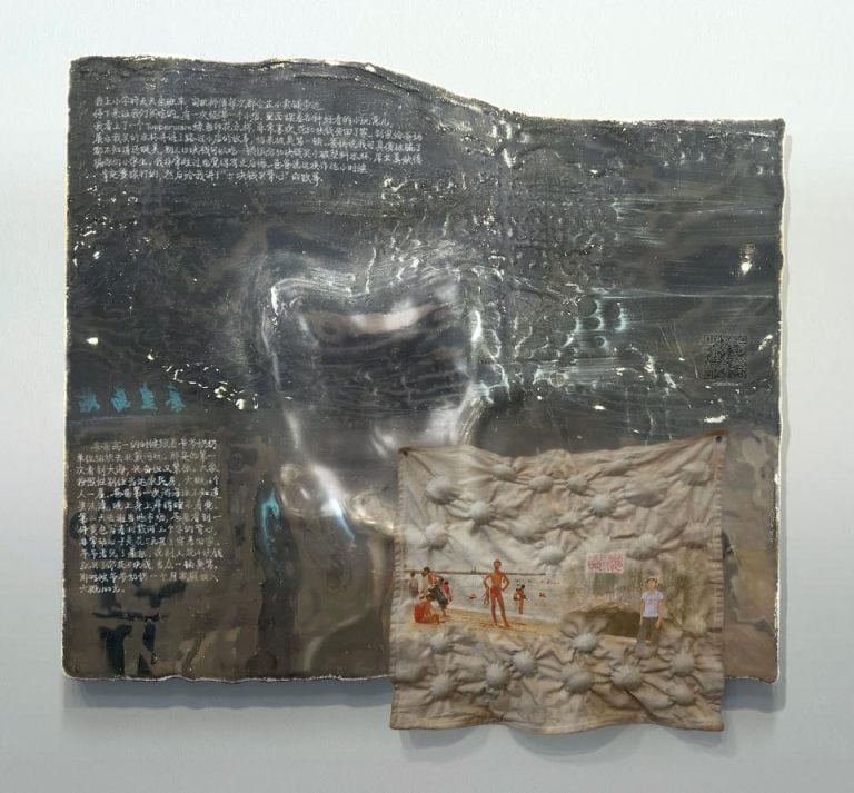 Exploring Identity and Truth in Ziyi Zhang's interactive Family Photo Album Metalic art installation with engraved text and fabric photo collage, contemporary mixed media artwork.