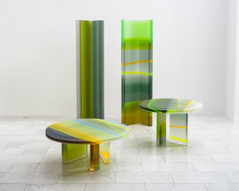 FLARE: Draga & Aurel's Lucite Capsule is a mesmerizing exploration of refraction Bright abstract modern furniture with colorful glass surfaces and geometric design elements.