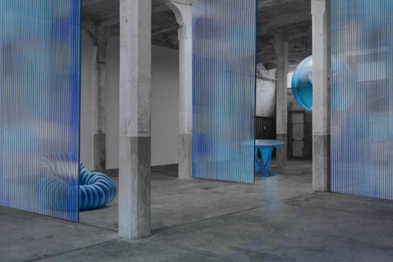 Isola Design Festival 2024: Shaping the Future of Design Colorful modern art installation with blue corrugated panels in industrial space.