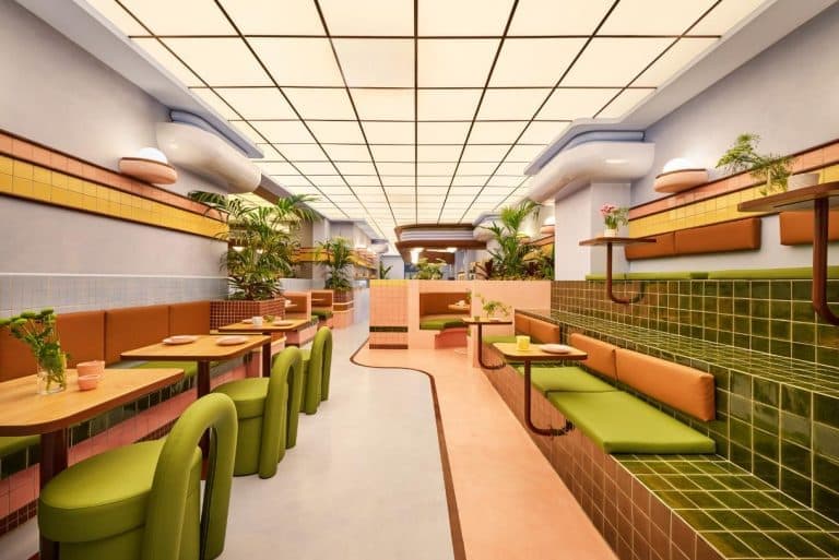 The Futuristic Charm of Amiko Gelato by Masquespacio in Barcelona Vibrant modern restaurant interior with colorful tiles and lush indoor plants.