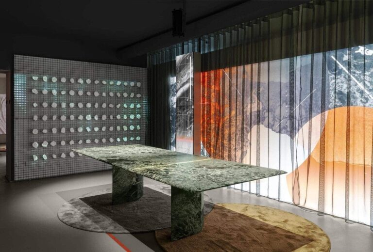 Sophisticated modern interior with stone table, circular wall art, and gradient sheer curtains.