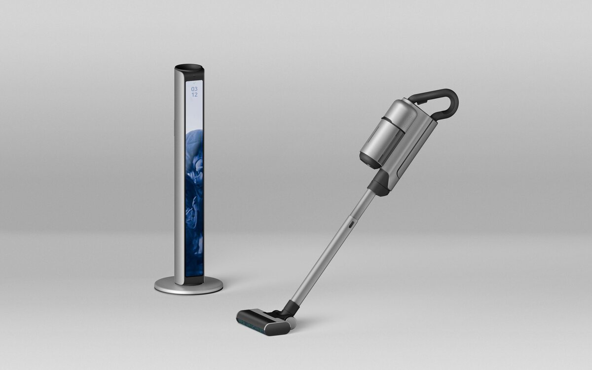 Modern cordless vacuum cleaner with digital display stand in a sleek, minimalist design.