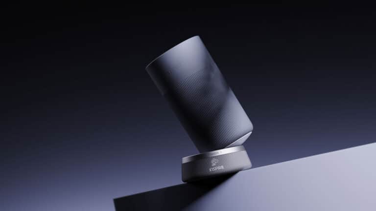 Sleek modern cylindrical speaker with a matte finish and minimalist design.