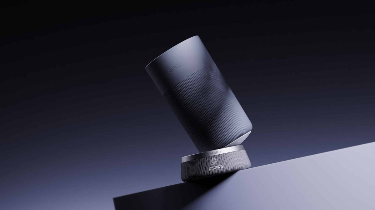 Sleek modern cylindrical speaker with a matte finish and minimalist design.