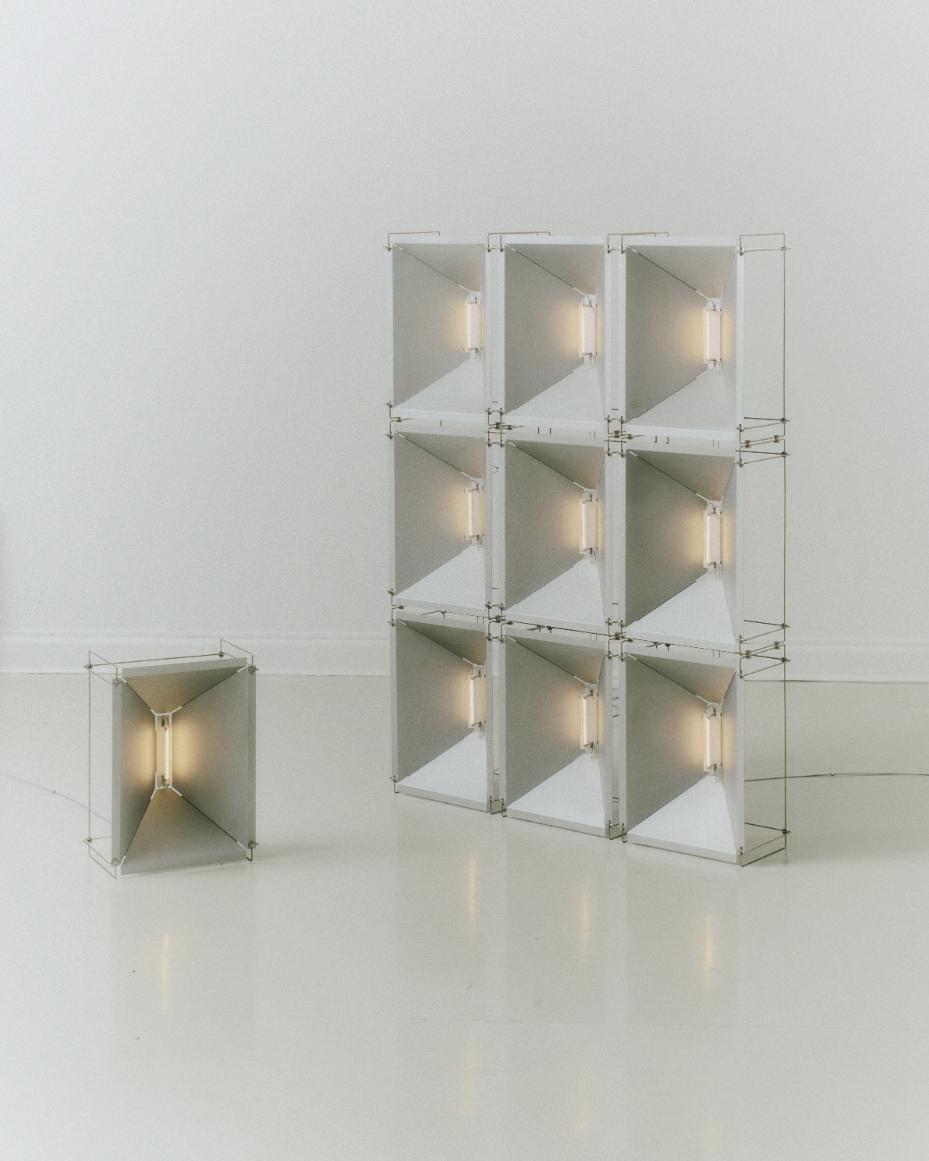 Futuristic modular lightboxes with geometric design for modern interior decor.