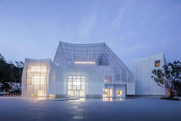 Flickering Peak a cultural landmark by Wutopia Lab symbolizing miracles and hope Futuristic white glass architecture building at dusk, modern design, innovative structure, clean lines, and artistic lighting.