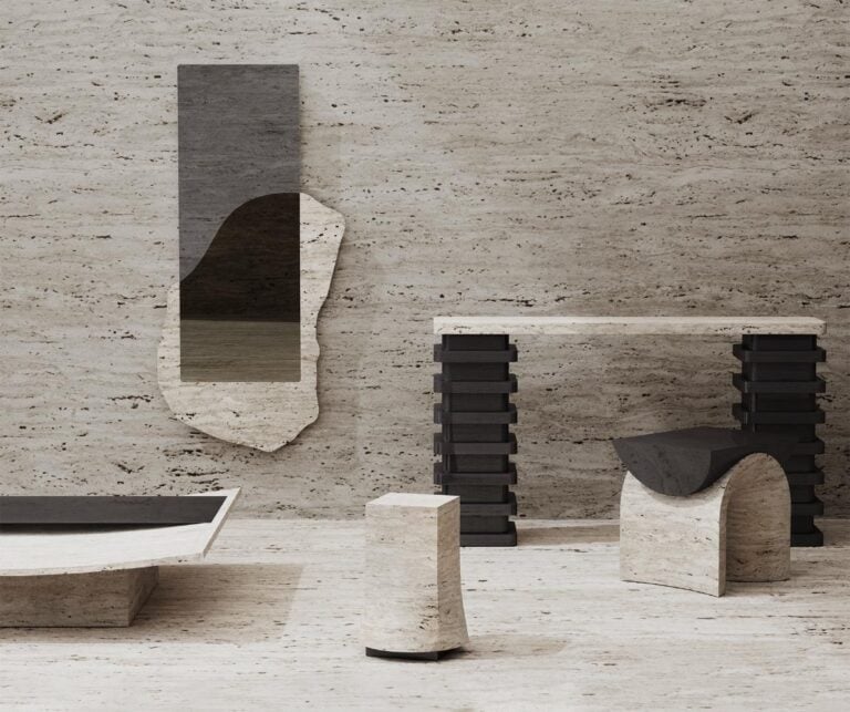 Collection 'Marks of Existence' Highlights The Allure Of Natural Materials Minimalist modern furniture with black and white marble elements on a textured stone background.