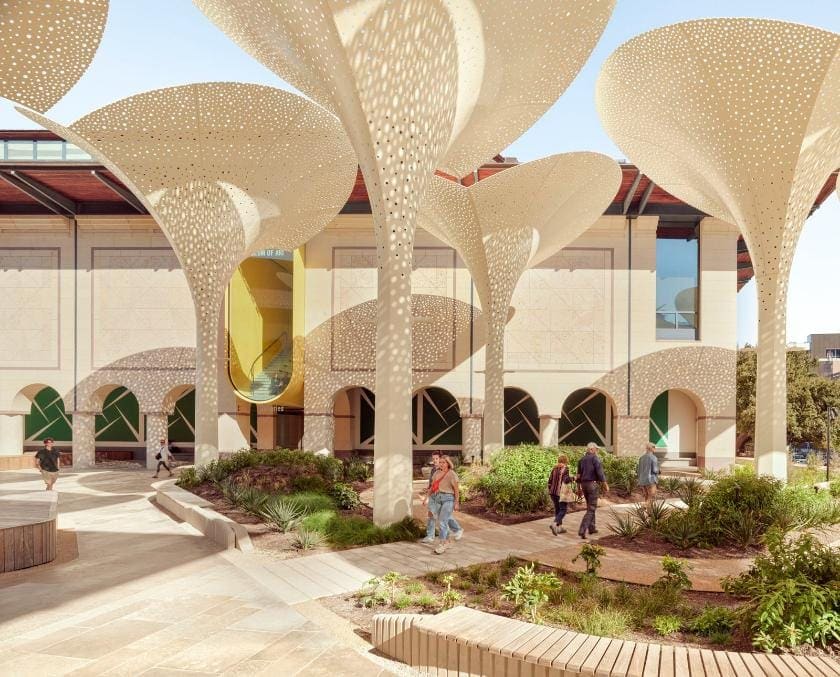 Colorful modern building with perforated architectural metal shading structures at Visual Atelier 8.