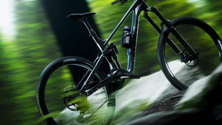 Inertia Studios capturing the thrill of revolutionary Marin Bikes Alpine Trail Advanced electric mountain bike cycling through forest terrain for outdoor adventure.