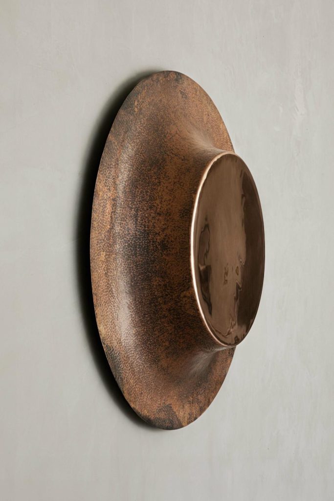 Copper Collection 2024 by Manu Bañó reveals the intrinsic properties of copper Rustic metal wall art sculpture with a circular design, modern interior decor piece.