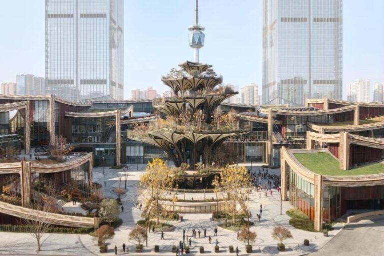 Heatherwick Studio's ceramic-inspired Xi’an District Futuristic urban plaza with innovative architecture and a central fountain in a bustling city environment, featuring modern skyscrapers.